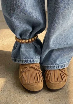 Taupe suède clogs met franjes